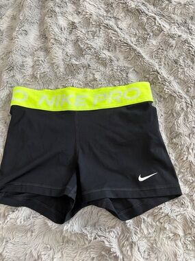 Nike Women's Black Athletic Shorts with Neon Yellow Waistband
